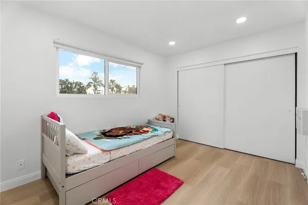 a bedroom with furniture and a bed