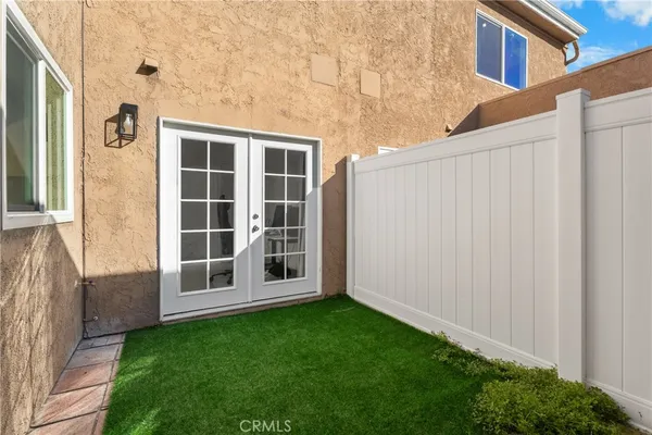 a view of house with backyard and garden