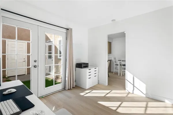 a view of a bedroom with furniture and window