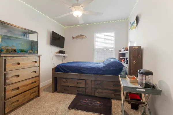 a room with a bed and furniture