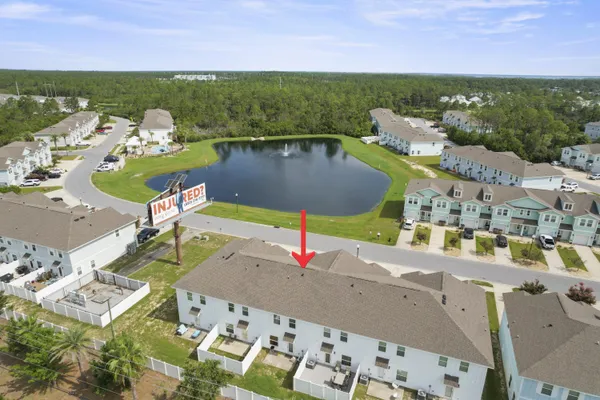 a view of a lake with a table and chairs