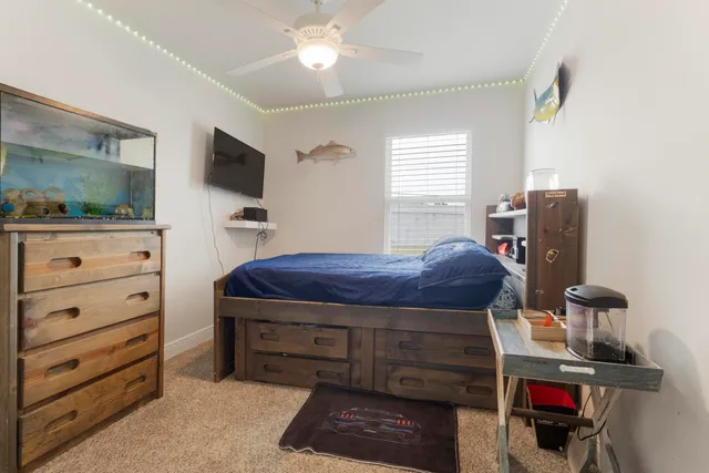 a room with a bed and furniture