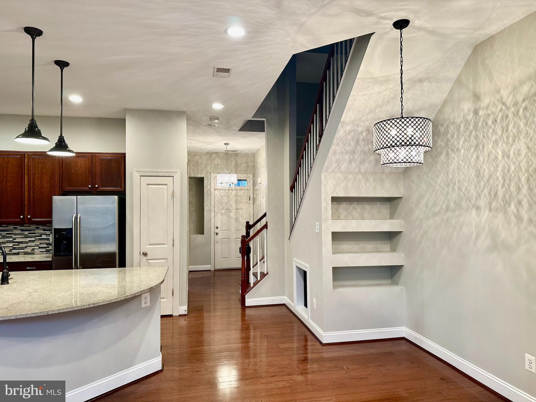 9032 Ribbon Falls Loop Bristow, VA 20136 - Photo 11 of 31 a hallway with a wooden floor and entryway