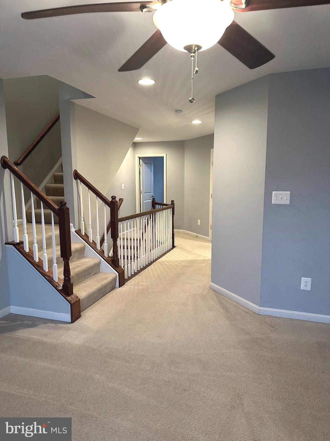 9032 Ribbon Falls Loop Bristow, VA 20136 - Photo 13 of 31 a view of a hallway with staircase