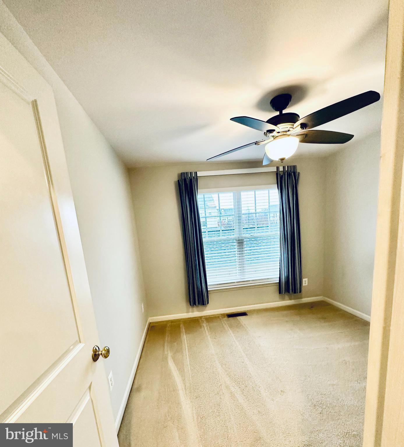 9032 Ribbon Falls Loop Bristow, VA 20136 - Photo 14 of 31 a view of an empty room with a window