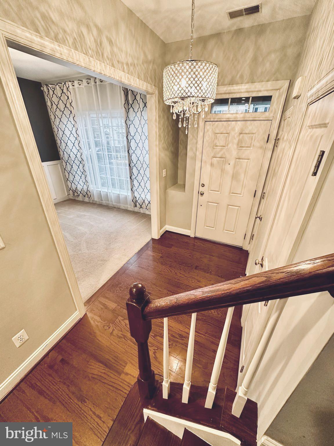 9032 Ribbon Falls Loop Bristow, VA 20136 - Photo 3 of 31 a view of entryway with wooden floor
