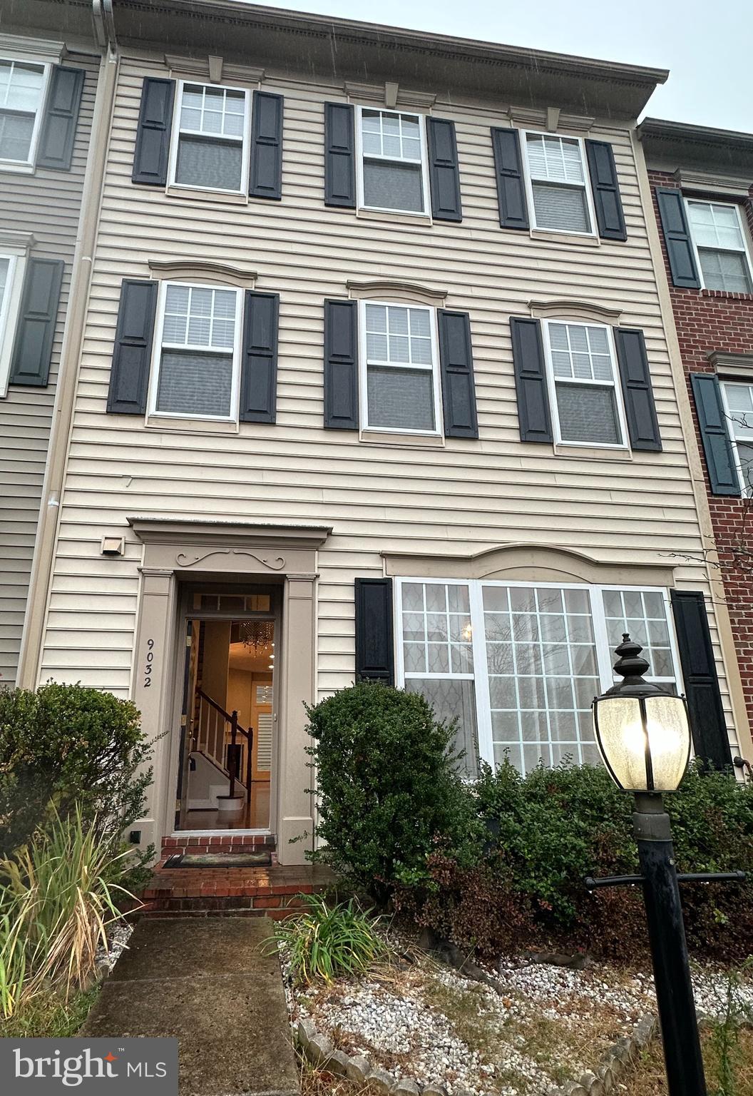 9032 Ribbon Falls Loop Bristow, VA 20136 - Photo 7 of 31 a front view of a house with yard