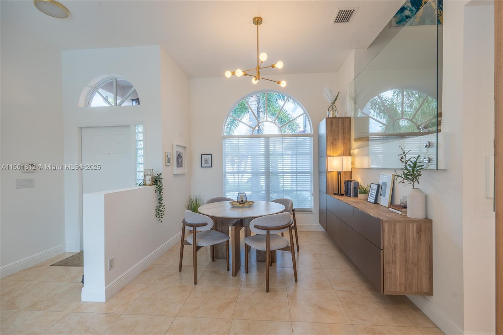 18004 Southwest 20th Street Miramar, FL 33029 - Photo 13 of 49 a view of a dining room with furniture and chandelier