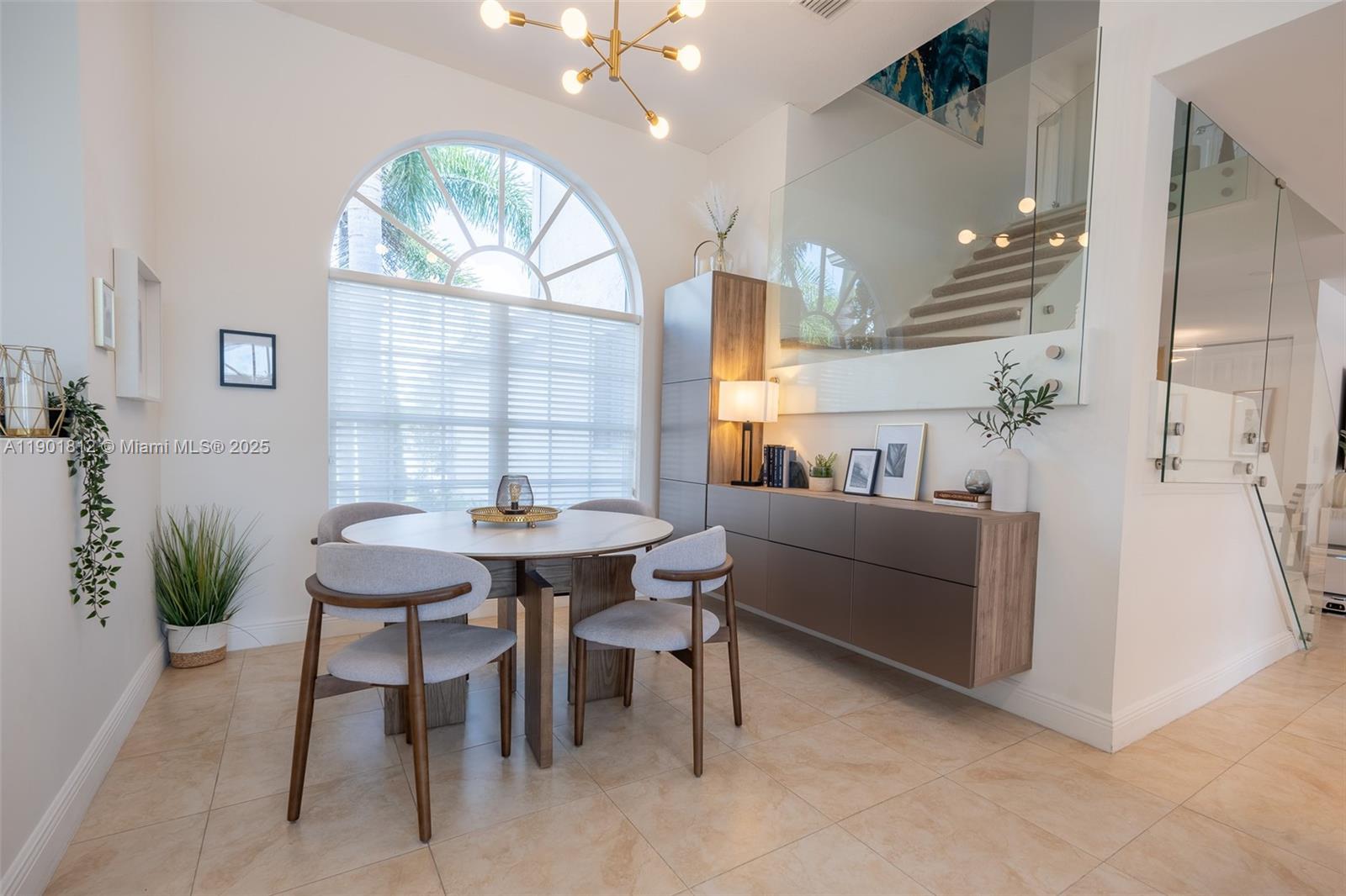 18004 Southwest 20th Street Miramar, FL 33029 - Photo 14 of 49 a view of a dining room with furniture and chandelier