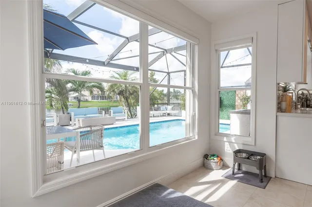 a view of a room that has a bed and a window