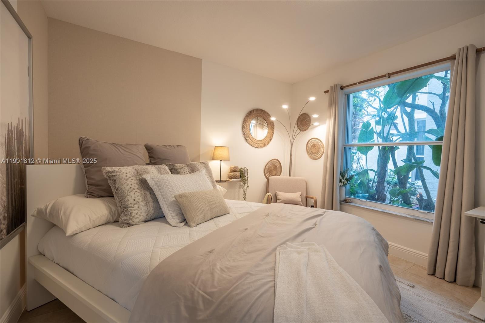 18004 Southwest 20th Street Miramar, FL 33029 - Photo 29 of 49 a bedroom with a large bed and a large window