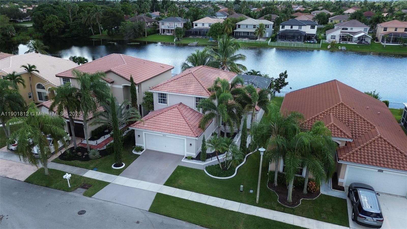 18004 Southwest 20th Street Miramar, FL 33029 - Photo 3 of 49 an aerial view of a house with outdoor space and lake view in back