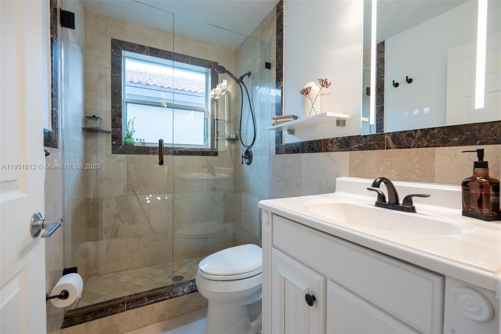 18004 Southwest 20th Street Miramar, FL 33029 - Photo 35 of 49 a bathroom with a sink a toilet and shower