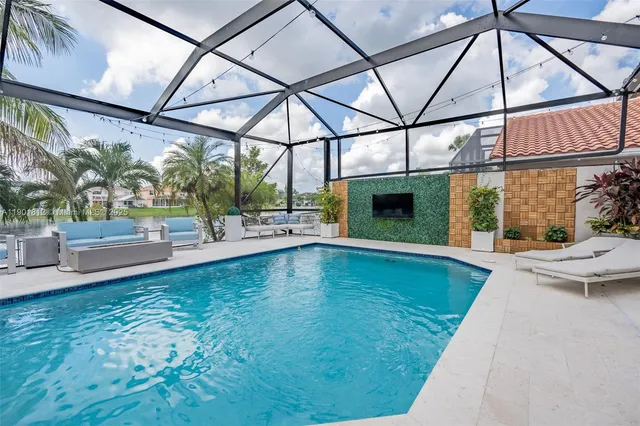 a view of a swimming pool with a patio