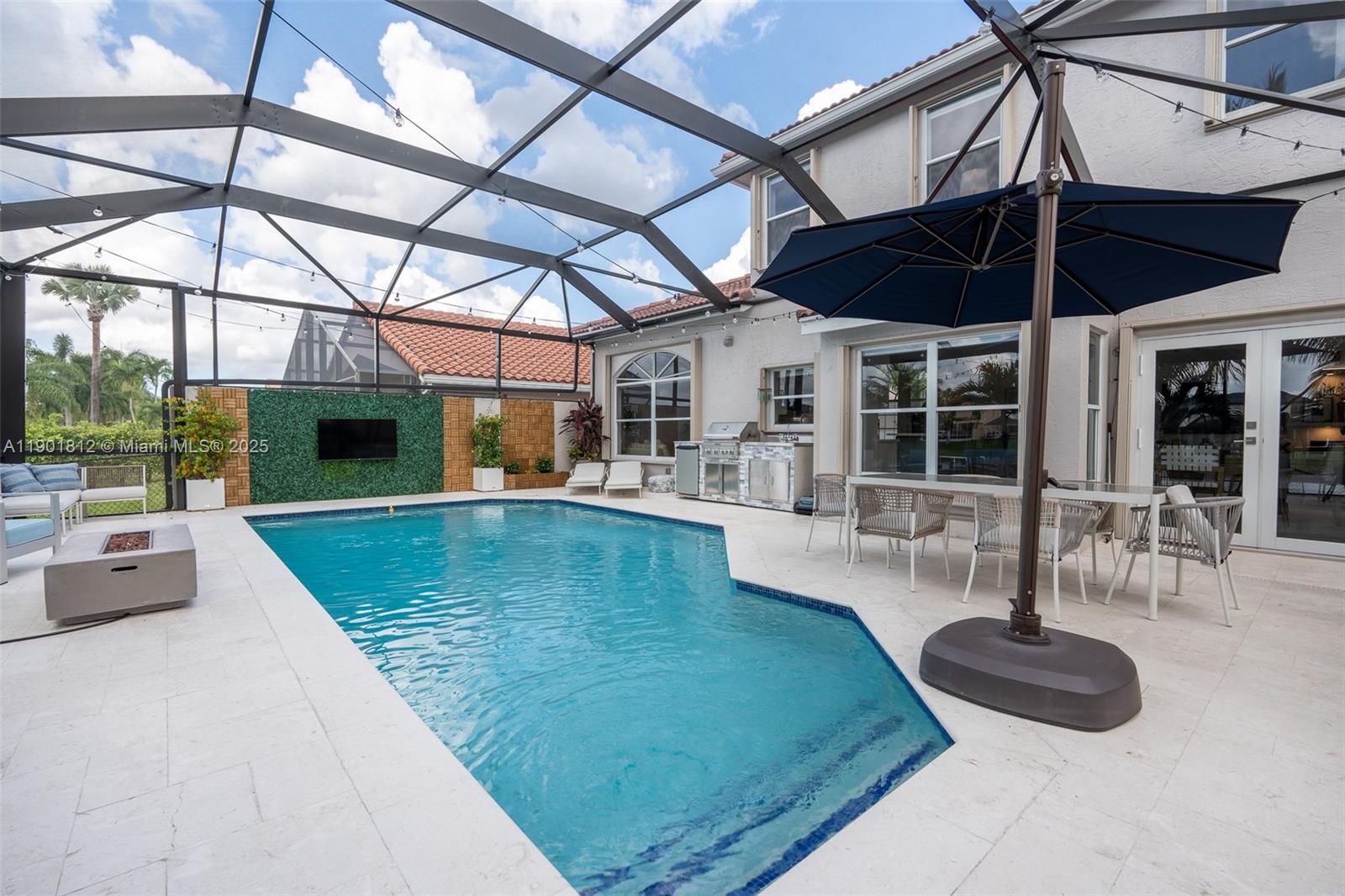 18004 Southwest 20th Street Miramar, FL 33029 - Photo 43 of 49 a view of a swimming pool with a patio