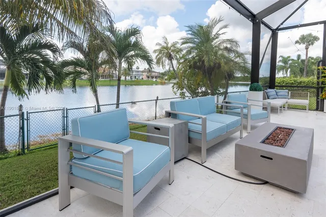 a view of a chairs and table in the patio