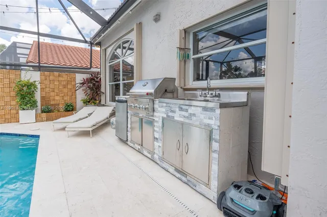 a view of a house with a backyard