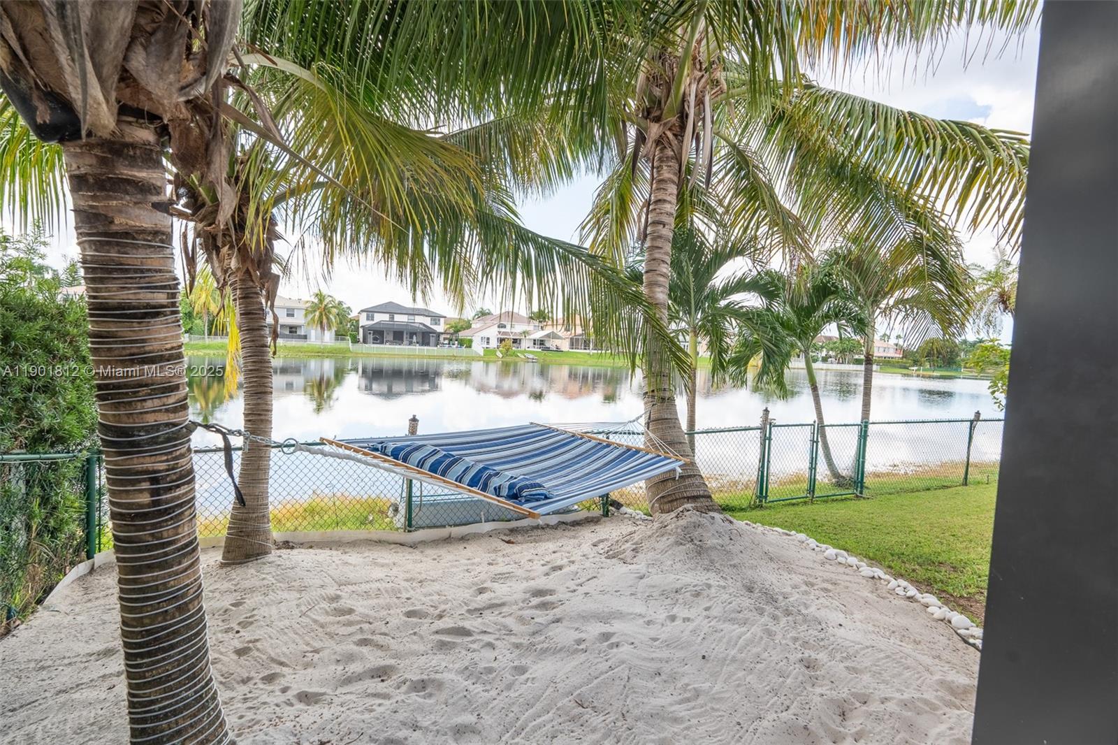 18004 Southwest 20th Street Miramar, FL 33029 - Photo 49 of 49 a view of a swimming pool with a garden and patio