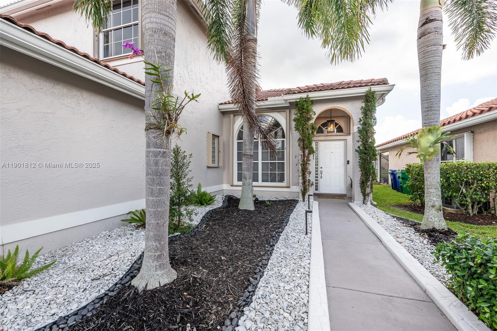 18004 Southwest 20th Street Miramar, FL 33029 - Photo 7 of 49 a front view of a house with a porch
