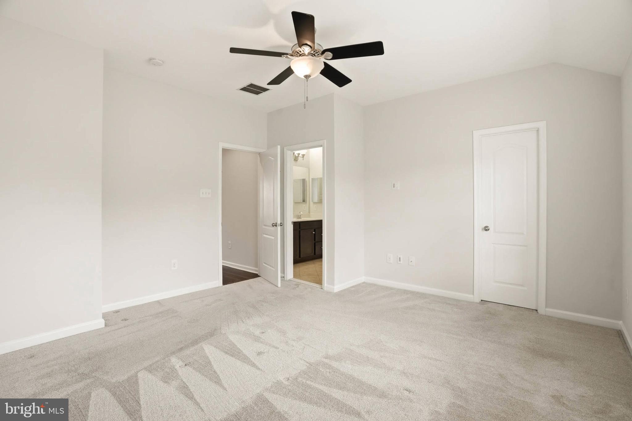 9817 Solar Course Laurel, MD 20723 - Photo 16 of 59 a view of an empty room with a ceiling fan