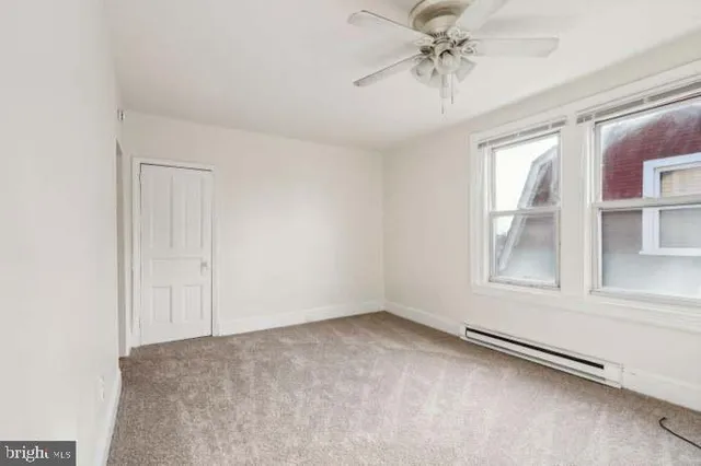 a kitchen with stainless steel appliances a stove refrigerator sink and cabinets