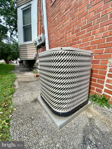 a front view of a building with sitting area