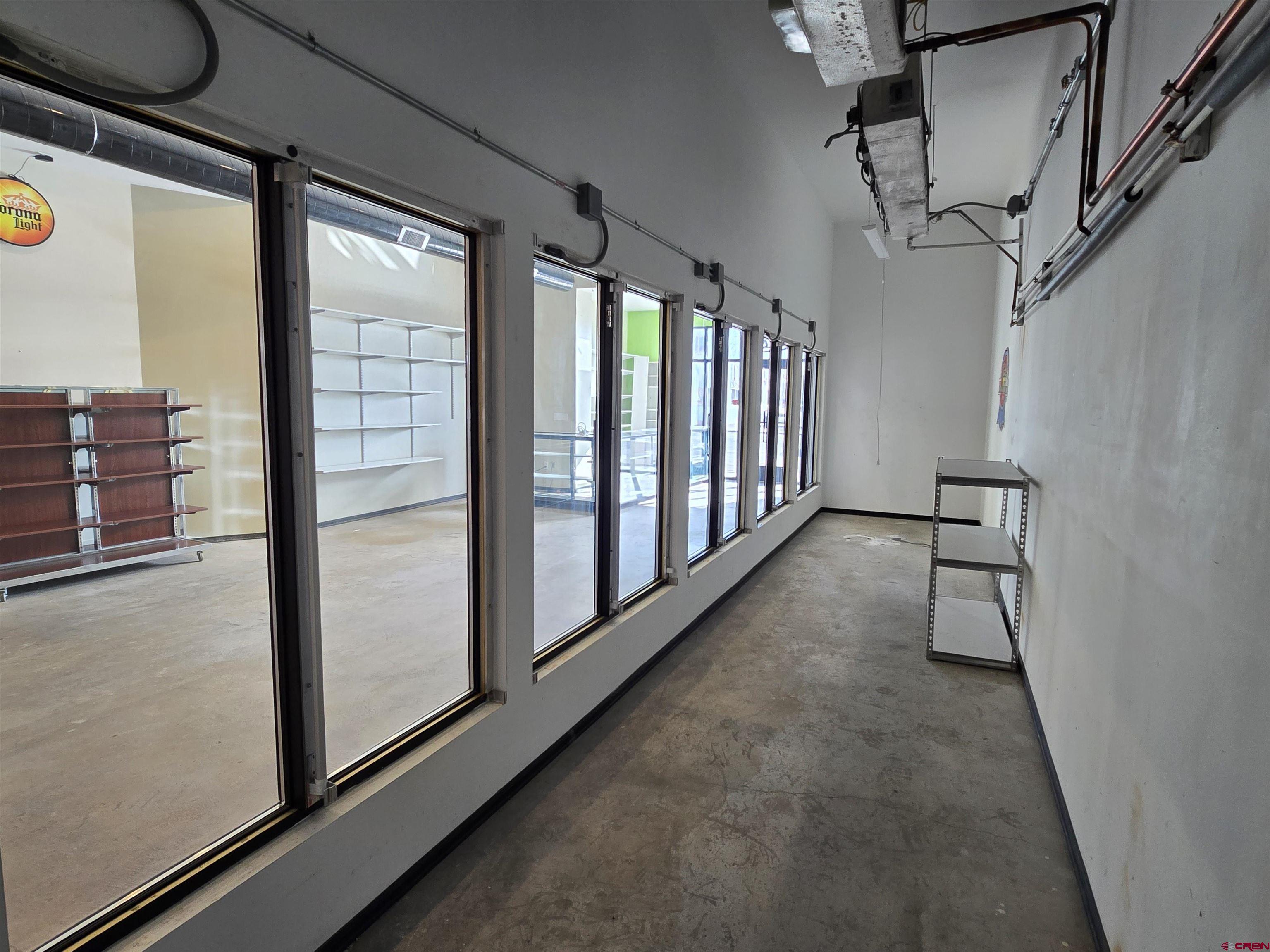 407 Main Street Alamosa, CO 81101 - Photo 6 of 13 a view of hallway with stairs