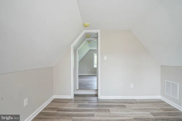 a view of a livingroom with wooden floor