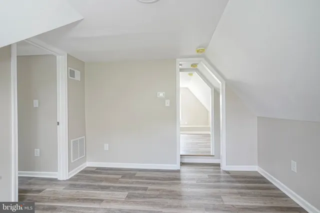 a view of a livingroom with wooden floor