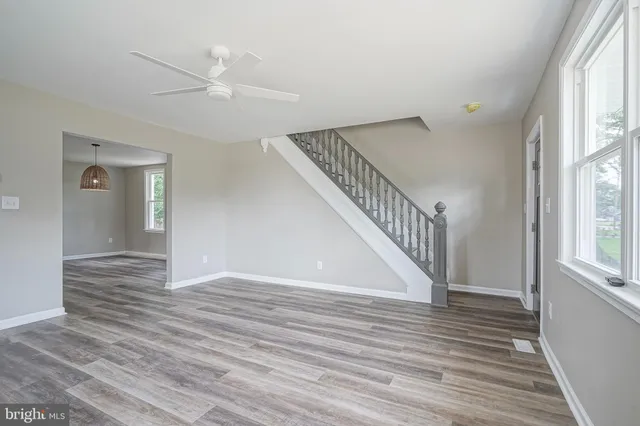 a view of an entryway with wooden floor