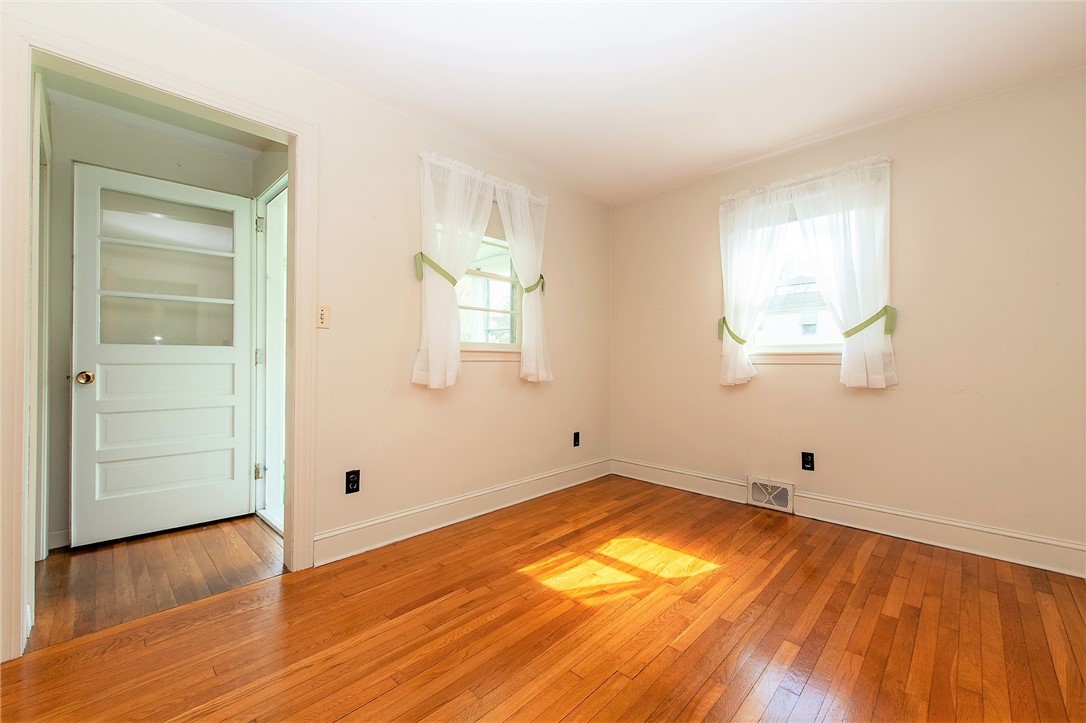 93 Lepes Road Tiverton, RI 02878 - Photo 14 of 21 bedroom 2 and door to sunroom