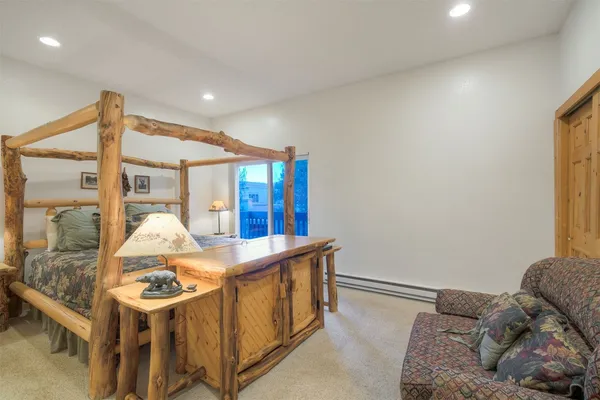 a living room with a couch and a large window