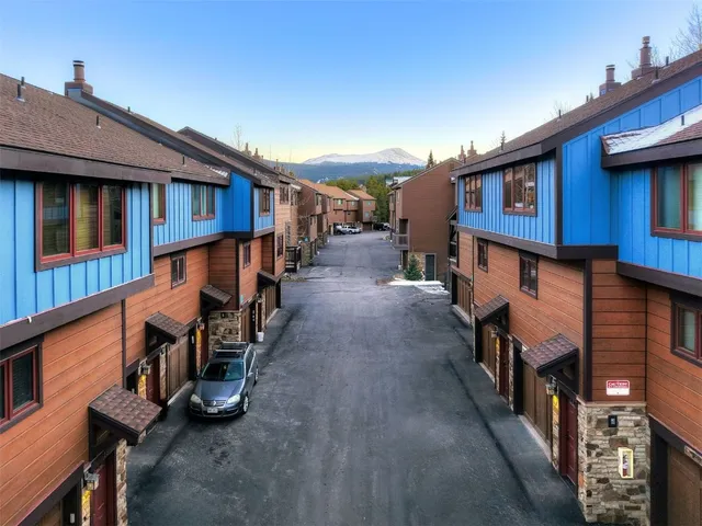 a view of a house with wooden stairs