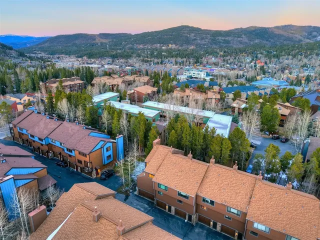 a view of a brick house with many windows