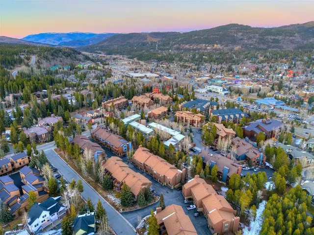 an aerial view of residential houses and outdoor space