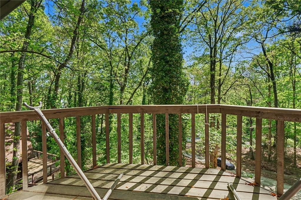 2530 Rockbridge Road Northwest Conyers, GA 30012 - Photo 37 of 45 a view of a balcony with wooden floor and fence