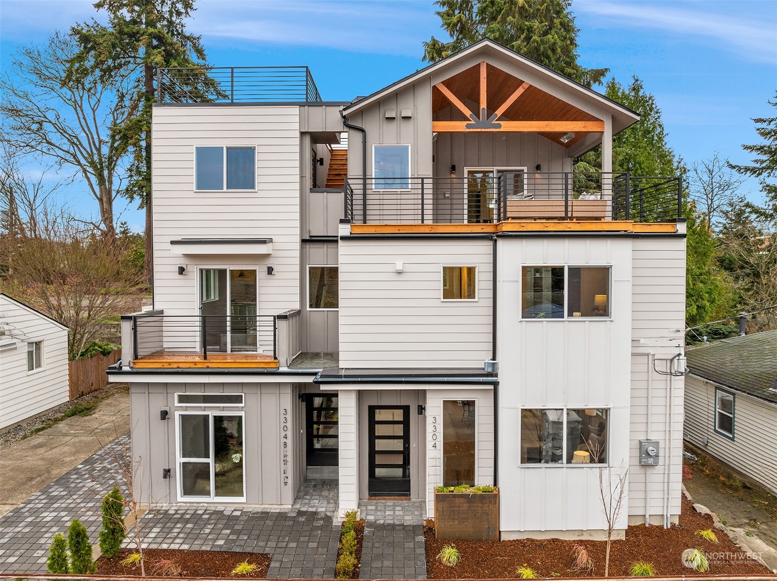 3304 49th Avenue Southwest Seattle, WA 98116 - Photo 1 of 34 a front view of a house with glass windows