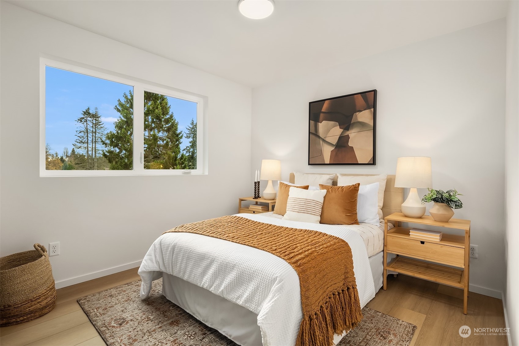 3304 49th Avenue Southwest Seattle, WA 98116 - Photo 16 of 34 a bedroom with bed and wall painting with wooden floor
