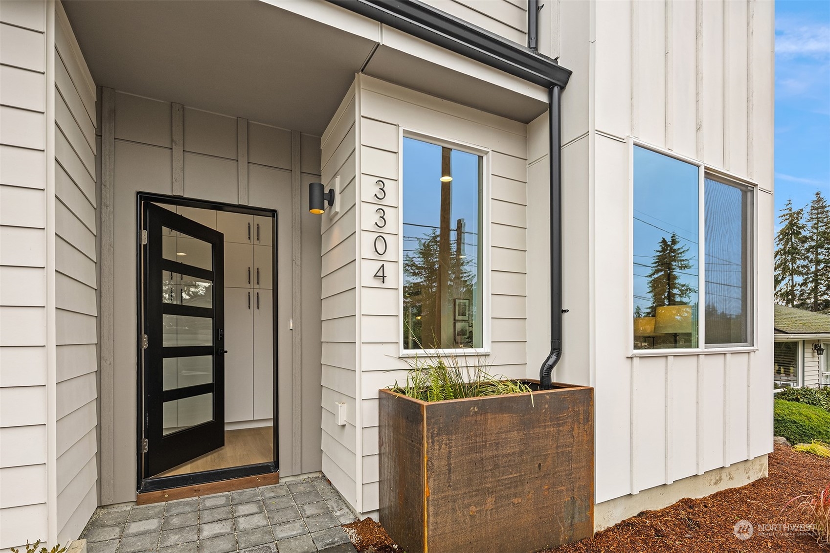 3304 49th Avenue Southwest Seattle, WA 98116 - Photo 2 of 34 a front view of a house with large windows