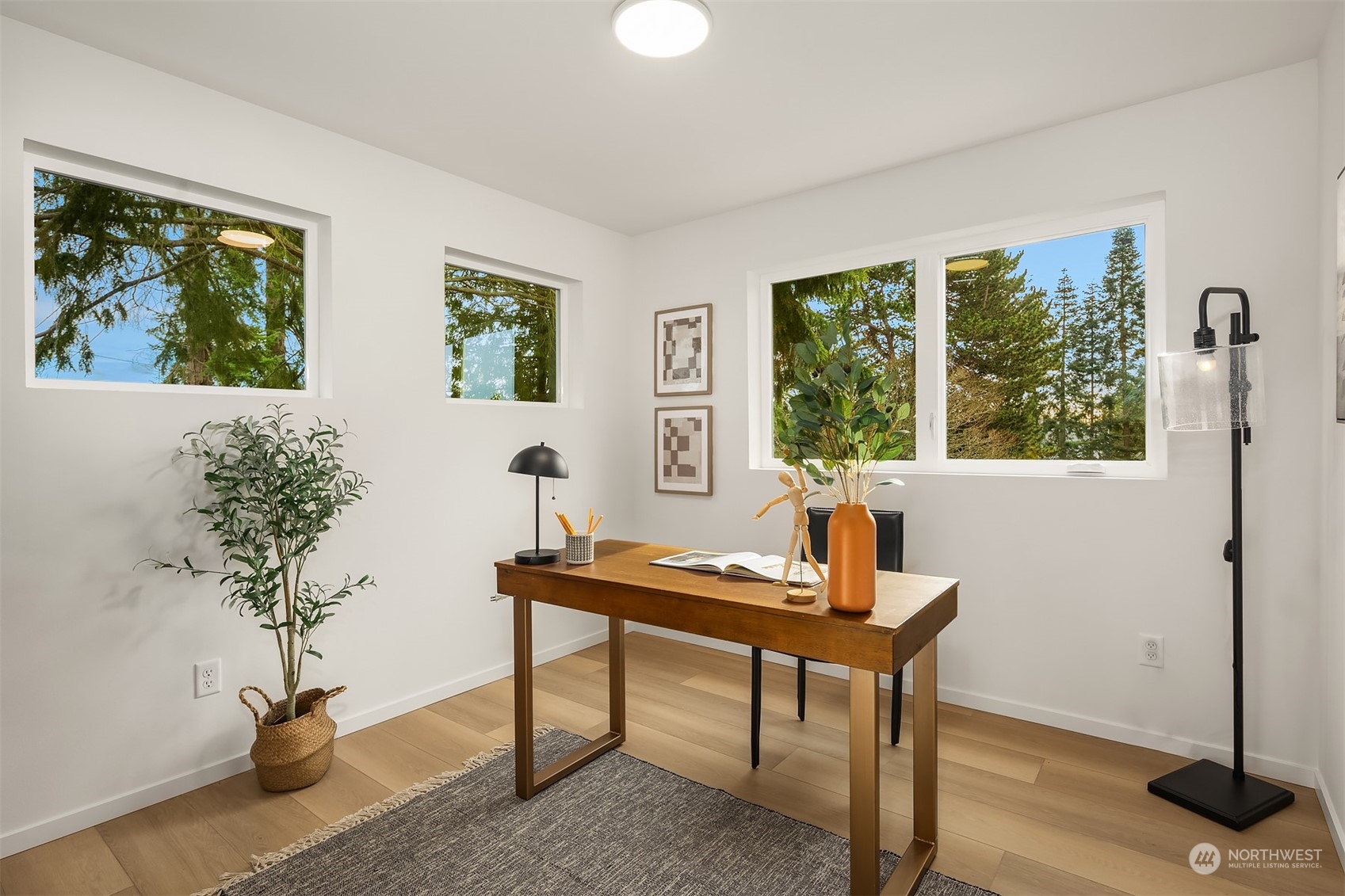 3304 49th Avenue Southwest Seattle, WA 98116 - Photo 21 of 34 a workspace with furniture and a potted plant