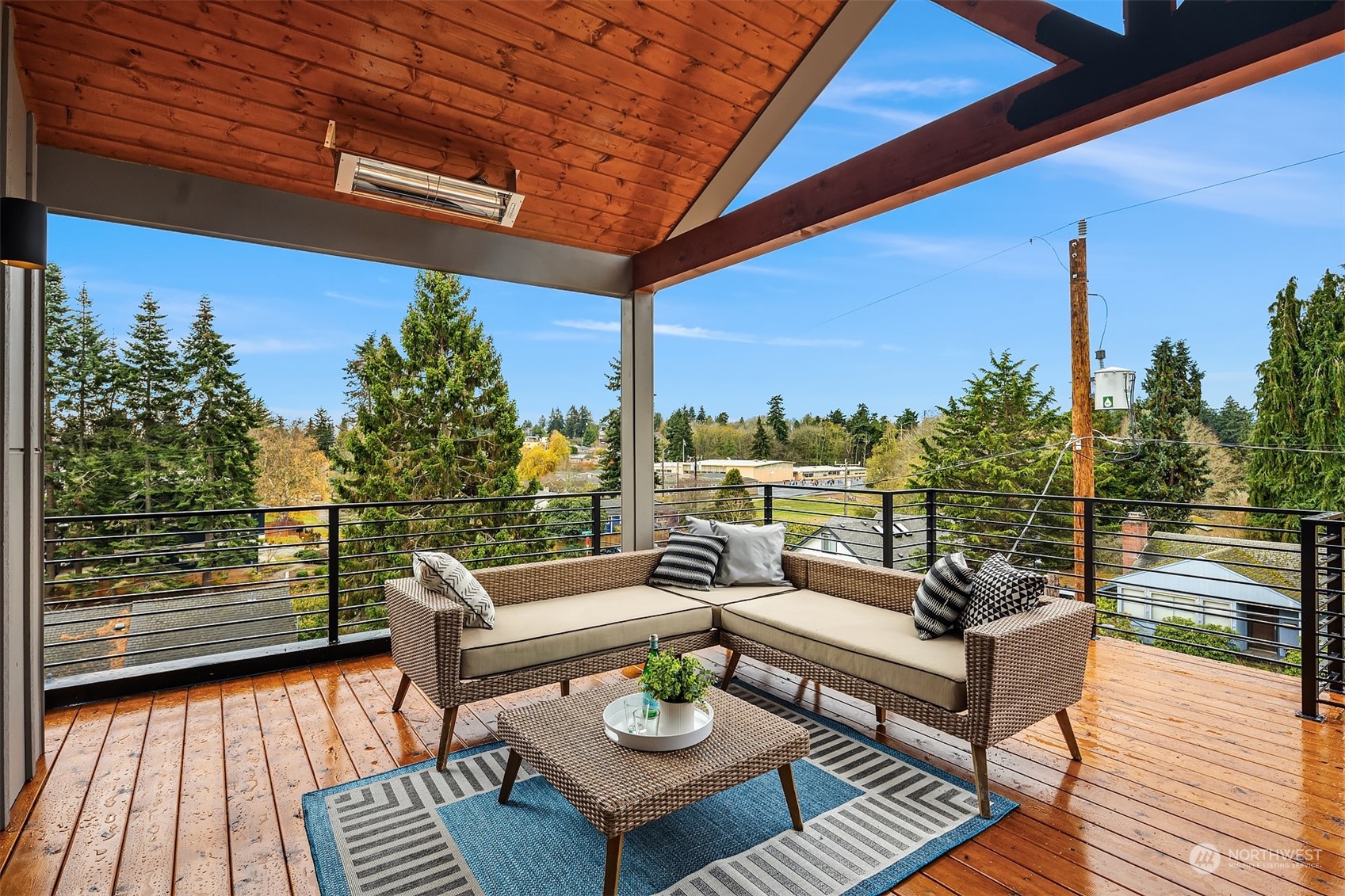 3304 49th Avenue Southwest Seattle, WA 98116 - Photo 24 of 34 a view of a balcony with wooden floor and outdoor seating