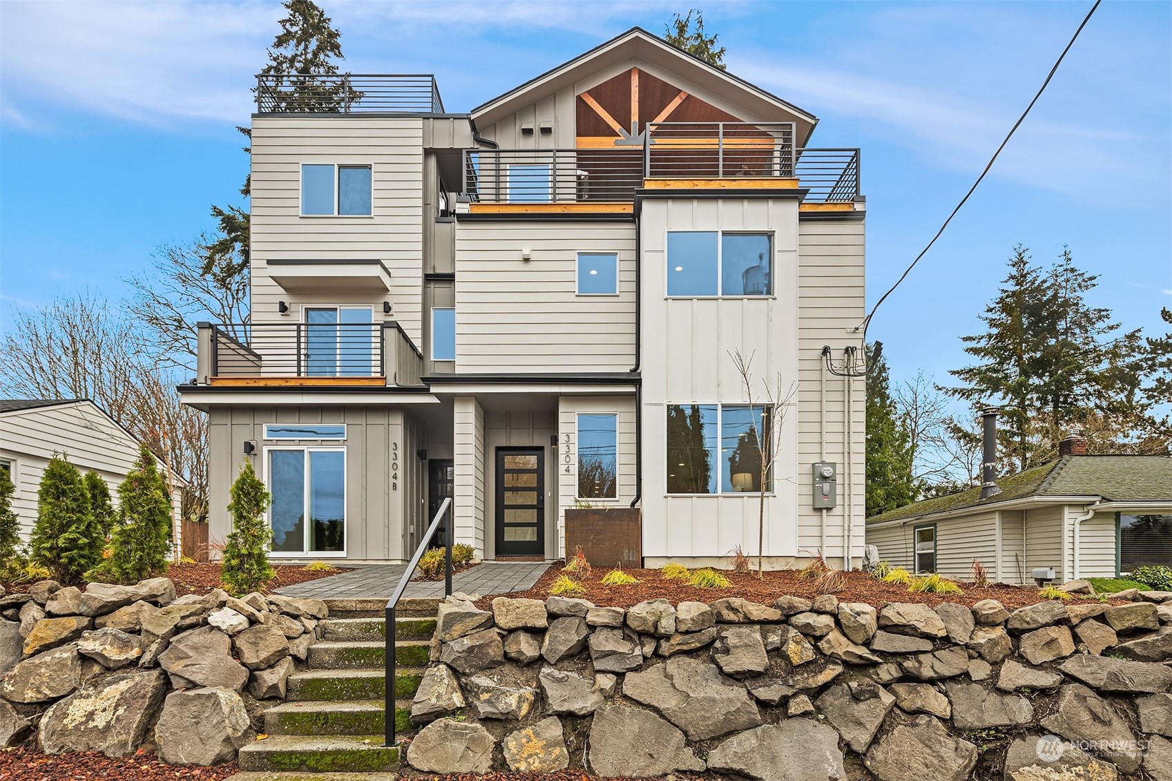 3304 49th Avenue Southwest Seattle, WA 98116 - Photo 30 of 34 a front view of a house with a yard