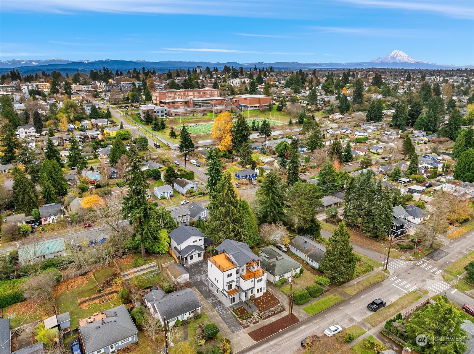 3304 49th Avenue Southwest Seattle, WA 98116 - Photo 32 of 34 an aerial view of residential houses with outdoor space