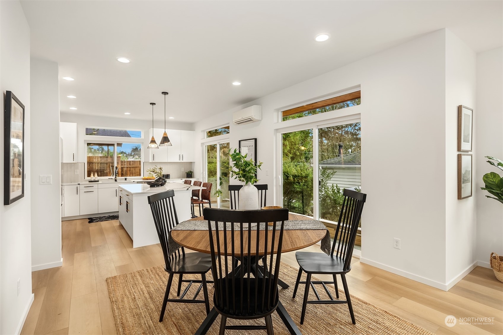 3304 49th Avenue Southwest Seattle, WA 98116 - Photo 6 of 34 a dining room with furniture and a floor to ceiling window