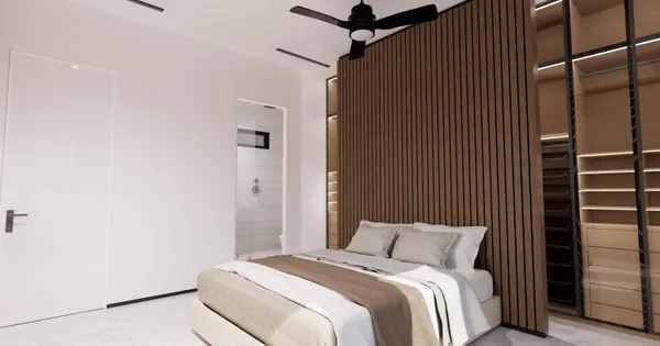 a bedroom with a bed and a window