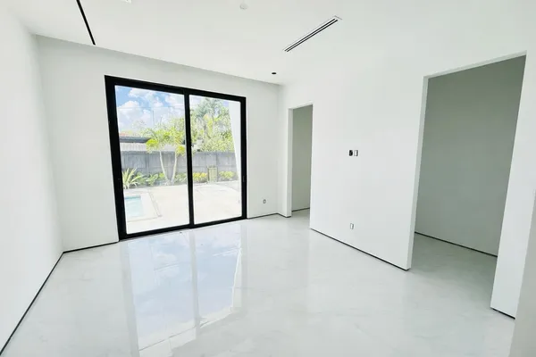 a view of a room with large windows