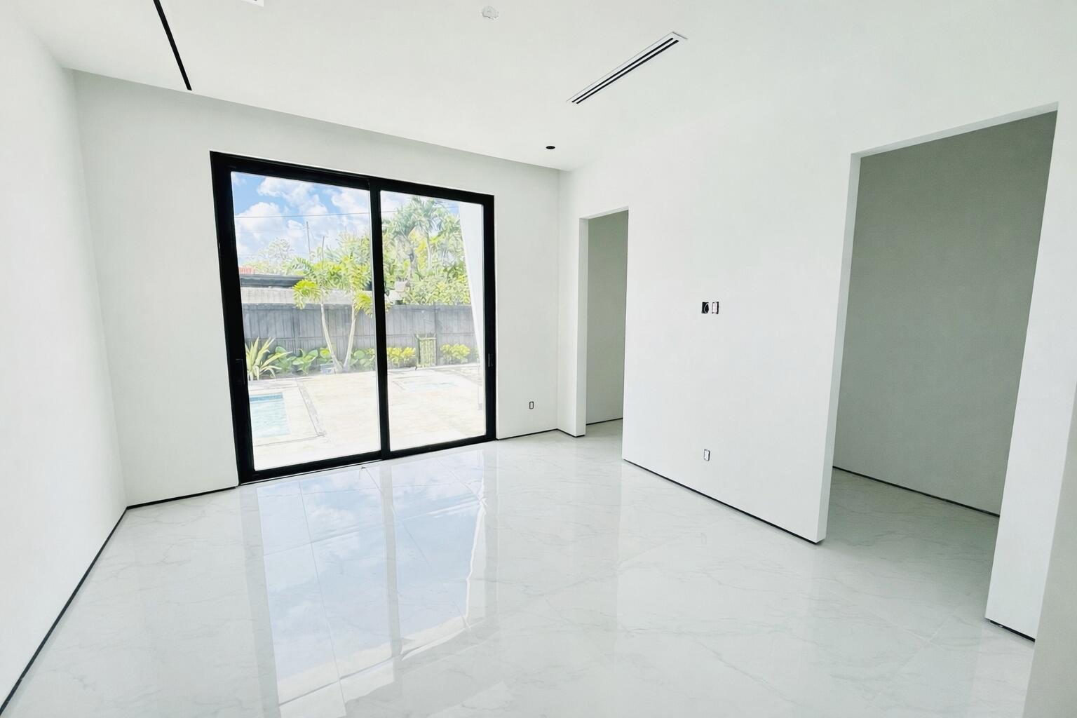 8966 Southwest 40th Terrace Miami, FL 33165 - Photo 22 of 40 a view of a room with large windows
