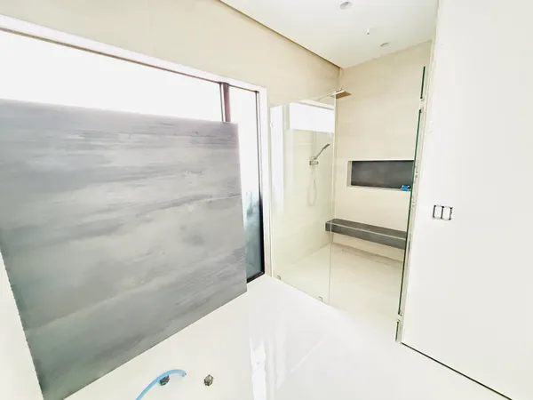 a bathroom with a bathtub and a shower