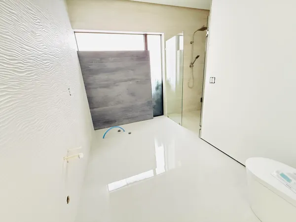 a bathroom with a shower and a sink