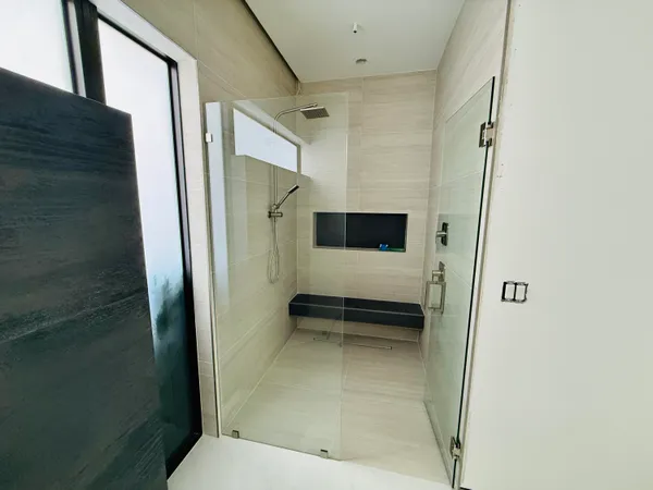 a bathroom with a shower and toilet